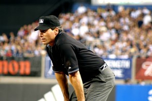 An umpire, symbol of justice, authority and moderation in action