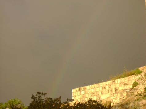 A rainbow, symbol of the covenant of God with man, appears over Jerusalem.