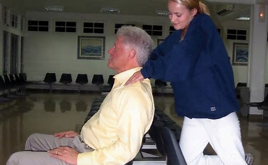 Former Democrat President Bill Clinton gets a neck massage. Problem: the girl is under age. From the Jeffrey Epstein file.