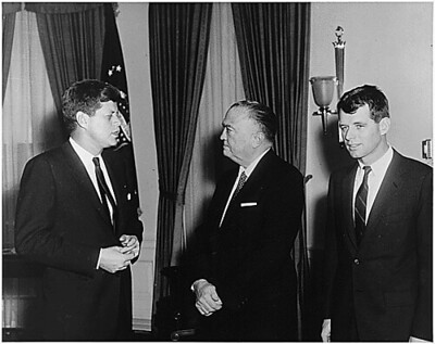Religion and politics collided during the campaign of President John F. Kennedy, shown here with his brother Robert and J. Edgar Hoover, Director, FBI.
