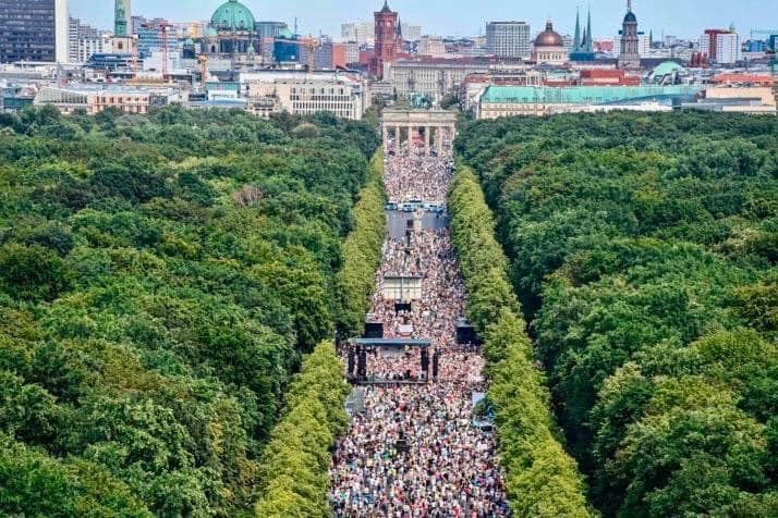 Rally in Germany at entrance to Tiergarten. Why aren't Americans doing such things?