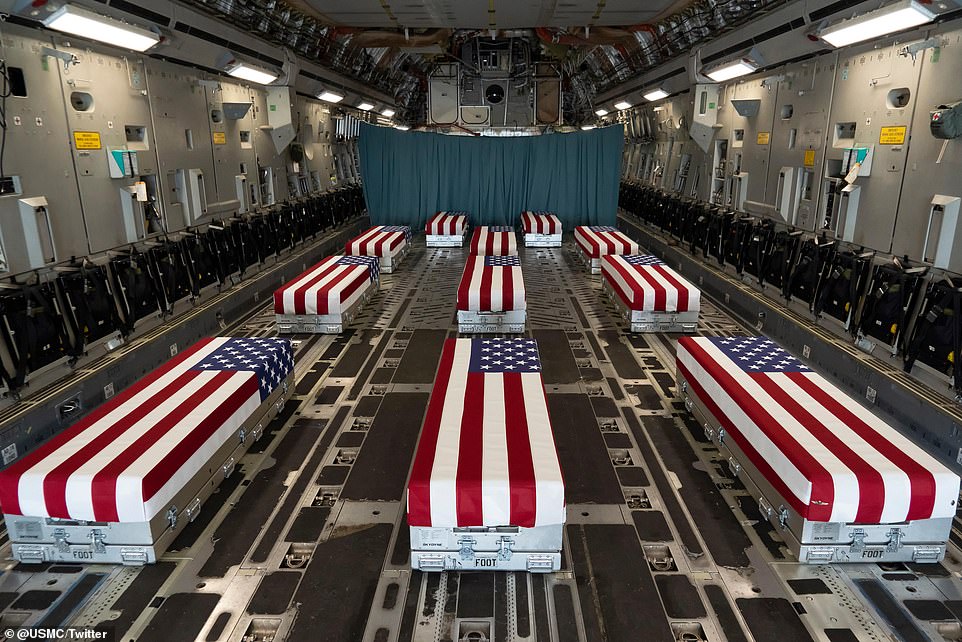 Flag-draped coffins delivered from Afghanistan, 11 in this flight.