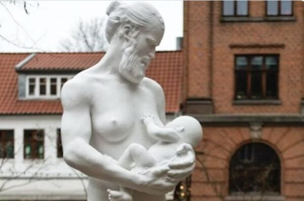 A statue of a naked, bearded man breastfeeding a baby has been placed outside the former Women’s Museum in Denmark.