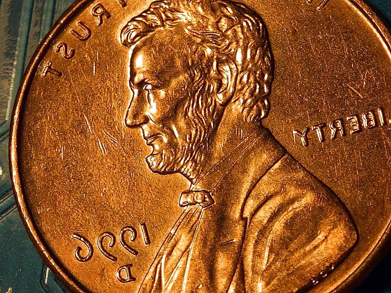 Lincoln penny head, in reverse for Waste of the Day