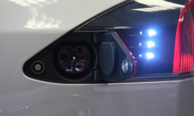 An EV charge port with multicolored lights