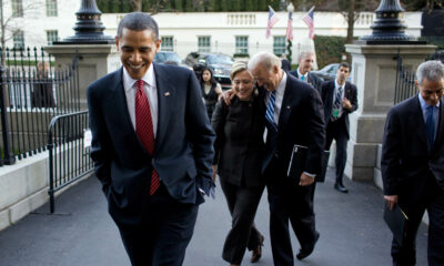 Barack Obama, with then-Vice-President Joe Biden in background, celebrating Obamacare - official WH photo