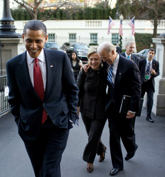 Barack Obama, with then-Vice-President Joe Biden in background, celebrating Obamacare - official WH photo