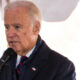 Biden in left profile close-up at microphone