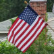 Flag of USA hanging from a single-family house
