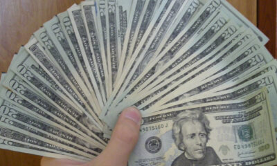 Fan of 20 dollar bills reflecting a debased currency facing entrepreneurs