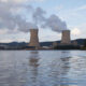 Nuclear power plant with two cooling towers and two reactor-containment buildings