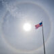USA flag in early afternoon at Eglin AFB in Florida with solar halo in sky