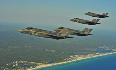 Four F-35 Lightning IIs line up for aerial refueling