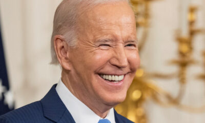 Biden grinning in right-forward-angle close-up