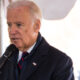 Biden making speech before washed-out white background