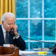 Biden on the telephone in the office with the window
