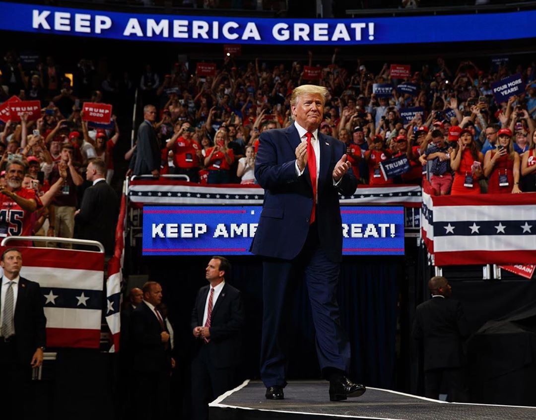 Donald Trump at a campaign rally in 2020 - note the Keep America Great banners.