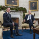 Emmanuel Macron and President Joe Biden pose for photographs in the White House.