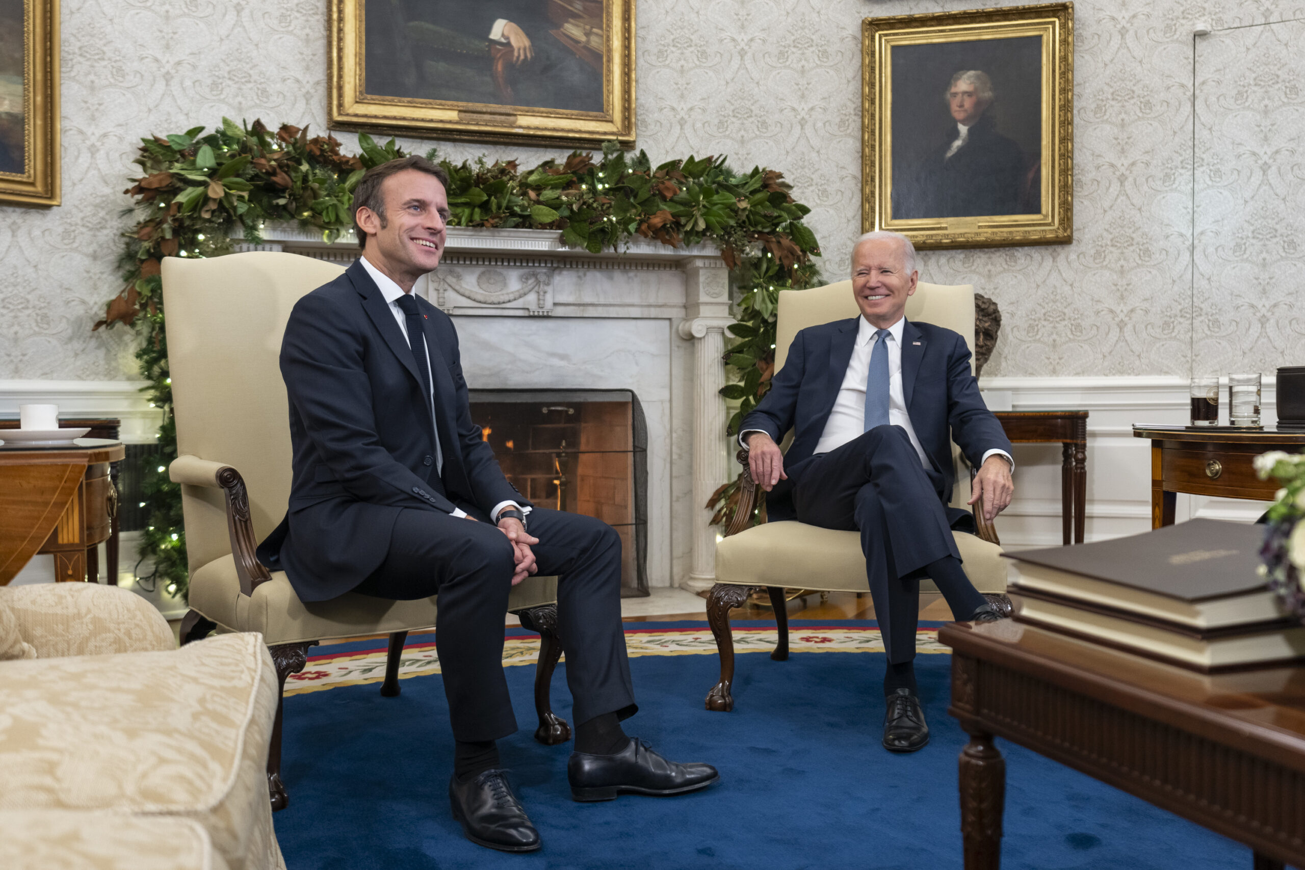 Emmanuel Macron and President Joe Biden pose for photographs in the White House.