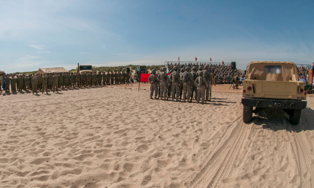 Troops gather on Normandy Beach to remember the fallen from D-Day or Operation Overlord