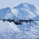 Alaska Air National Guard C-130 Hercules taking off over Joint Base Elmendorf-Richardson