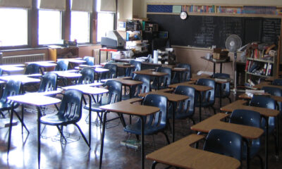 Classroom with desks facing away from chalkboard