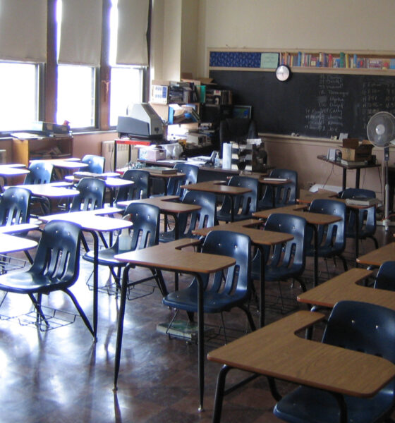 Classroom with desks facing away from chalkboard