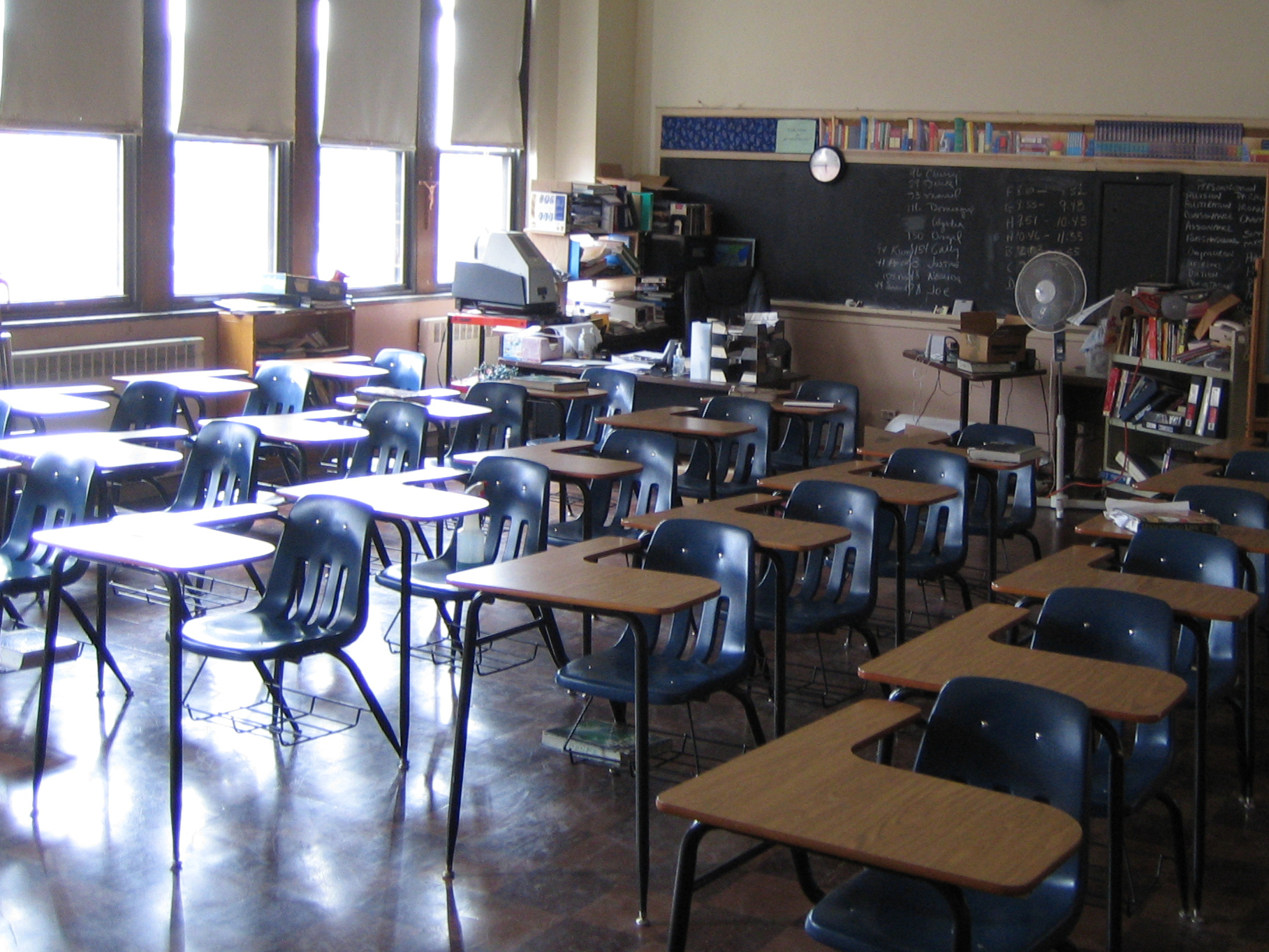 Classroom with desks facing away from chalkboard