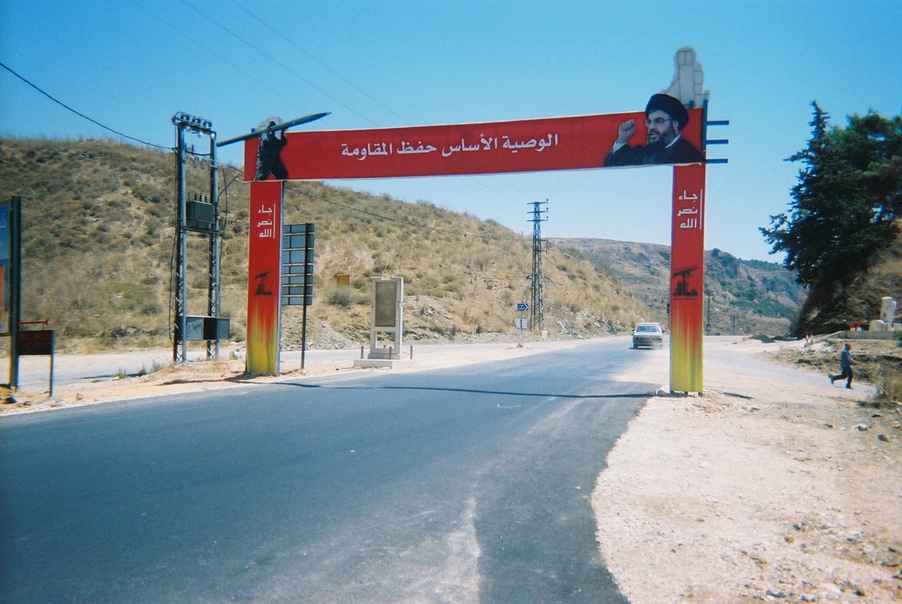 Hezbollah checkpoint with propaganda portrait of Nasrallah, its head