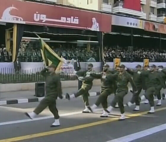 Hezbollah regulars parade down a city street in Beirut Lebanon