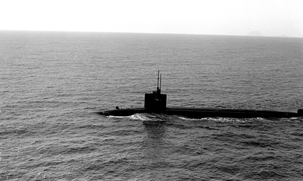 A port beam view of a nuclear-powered submarine underway.