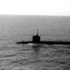 A port beam view of a nuclear-powered submarine underway.