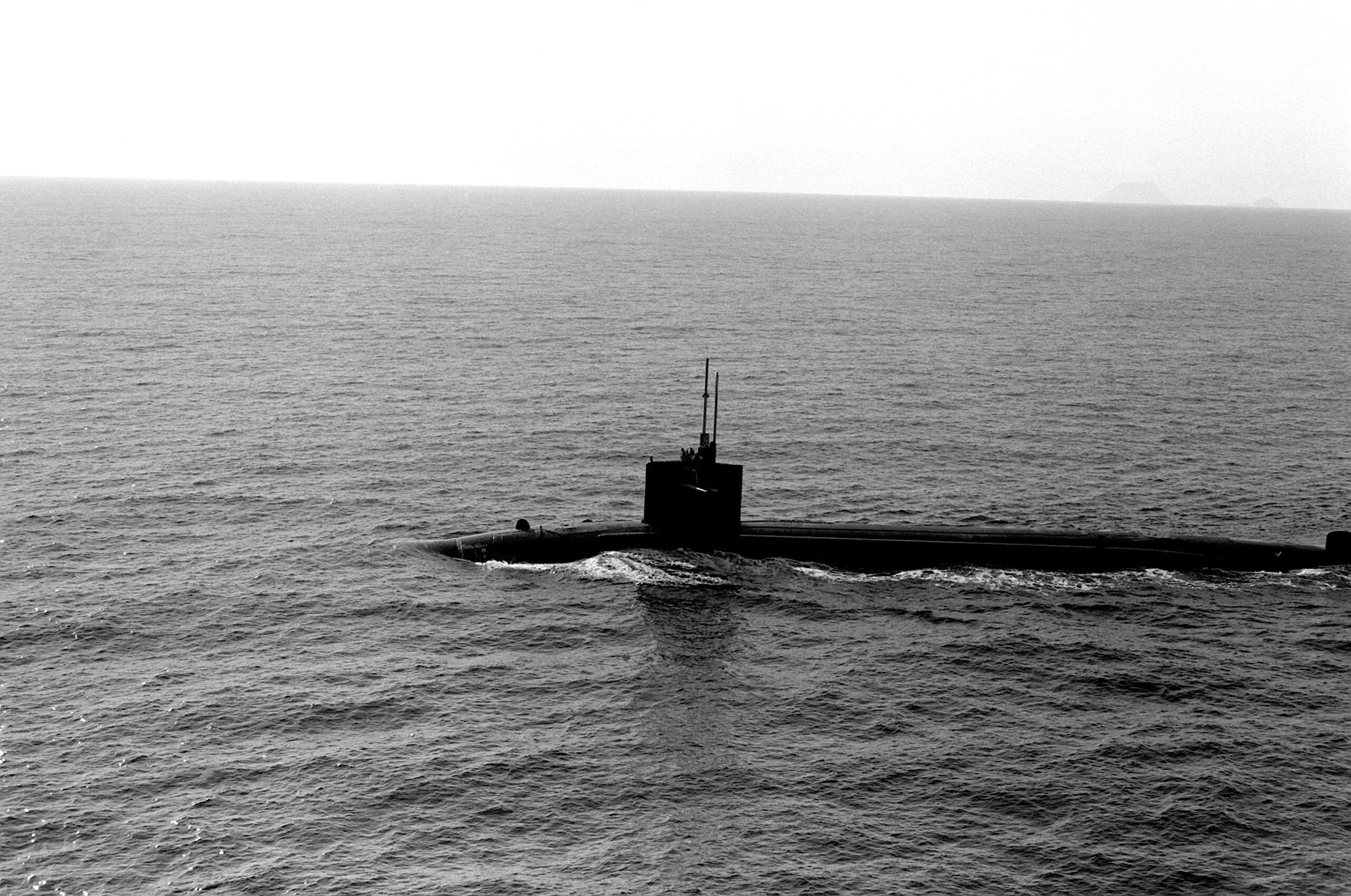 A port beam view of a nuclear-powered submarine underway.