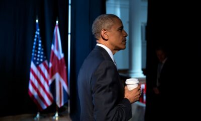 Barack Obama right profile holding a coffee cup