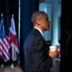 Barack Obama right profile holding a coffee cup