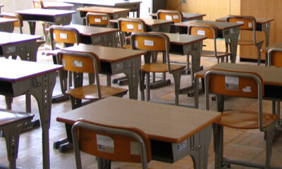 Classroom focusing on student desks and chairs