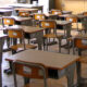 Classroom focusing on student desks and chairs