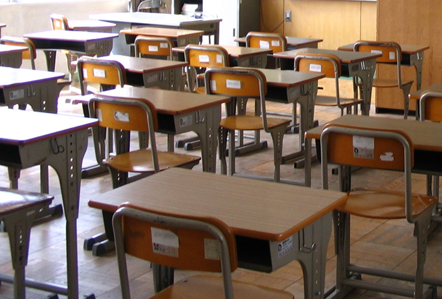 Classroom focusing on student desks and chairs