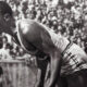 Jesse Owens on his mark in a track meet