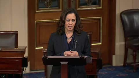 Senator Kamala Harris addresses the chair from her desk in the Senate chamber