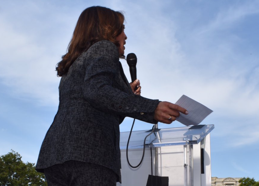 Senator Kamala Harris addresses an outdoor crowd