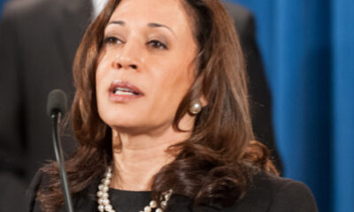 Kamala Harris addressing a meeting at the Justice Department