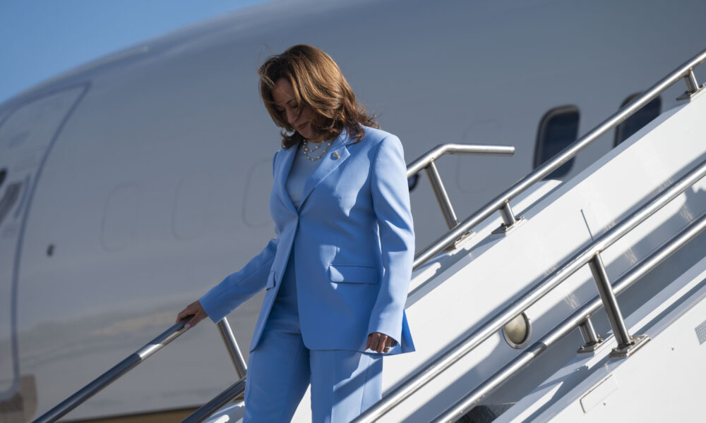 Vice President Kamala Harris deplanes from a C-32 (as Air Force Two) at Peterson Space Force Base, serving the Air Force Academy