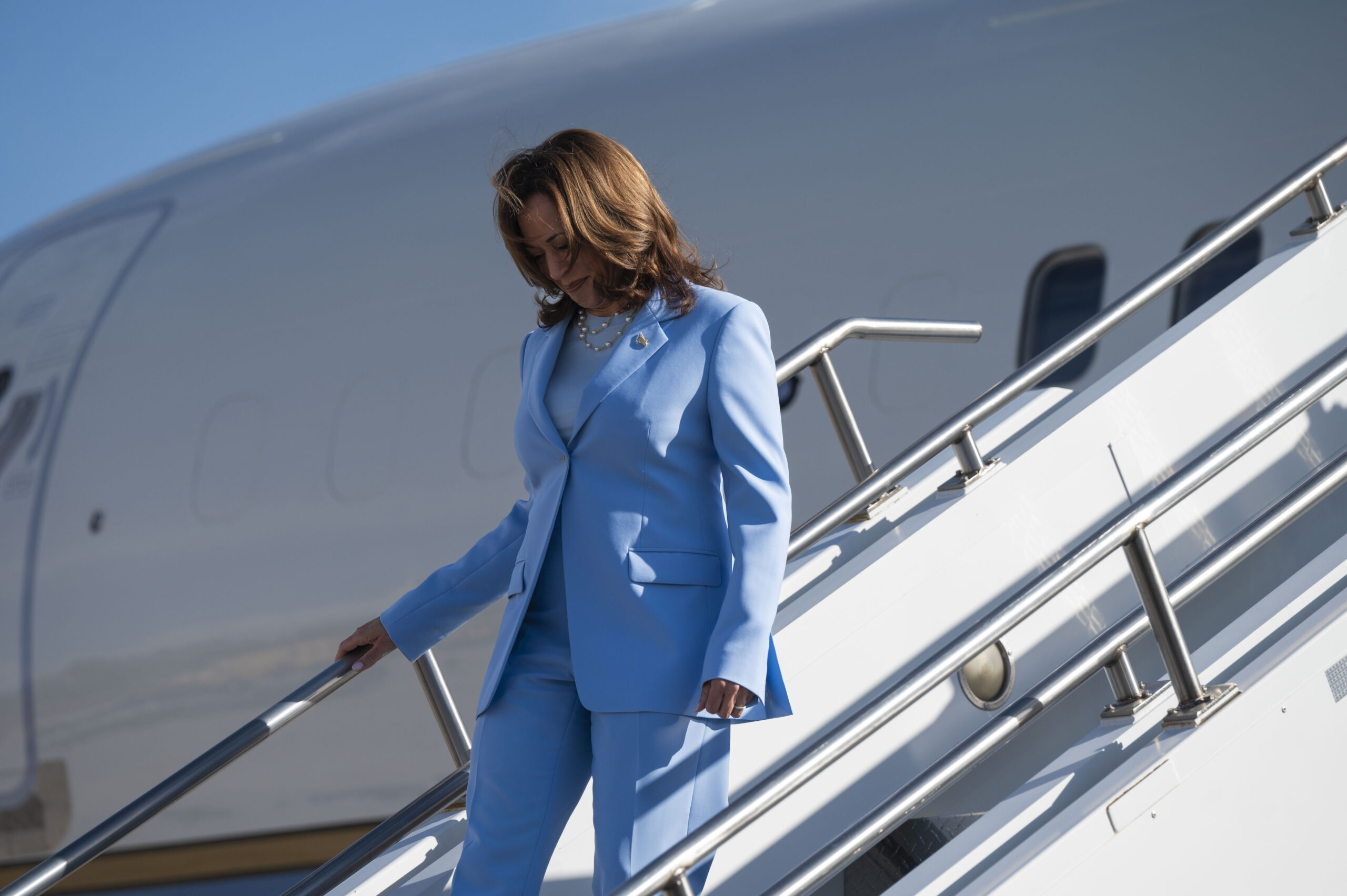 Vice President Kamala Harris deplanes from a C-32 (as Air Force Two) at Peterson Space Force Base, serving the Air Force Academy