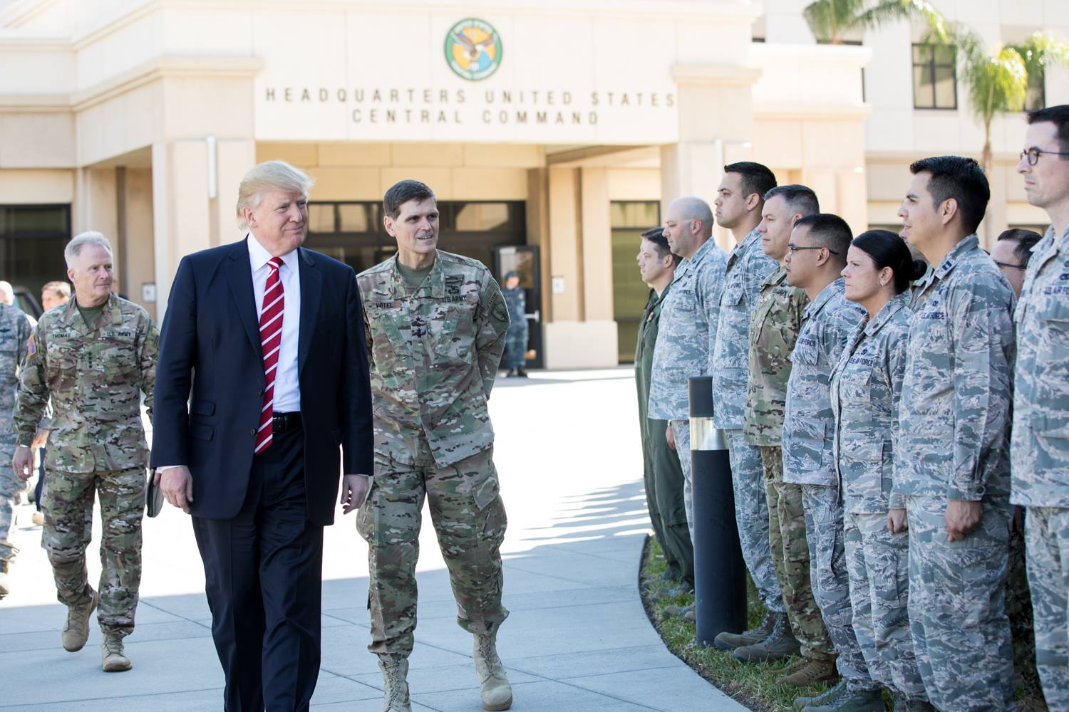 President Donald Trump inspects troops outside CENTCOM HQ