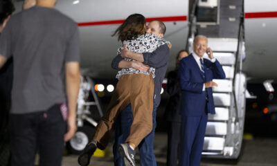 Journalists released from Russia return home note President Biden in background