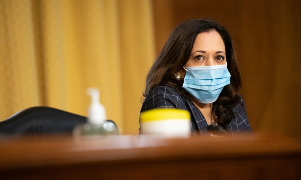 Senator Kamala Harris (D-Calif.) in mask sits at a committee hearing