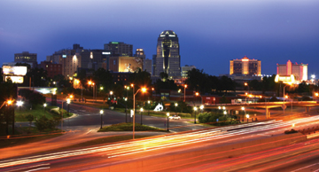 Shreveport, Louisiana skyline at night long-term exposure with well-trafficked thoroughfare in foreground