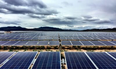 Solar farm under cloudy sky