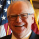 Governor Tim Walz of Minnesota close-up with USA flag behind him